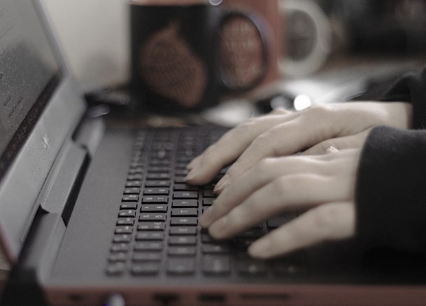 Person typing on laptop