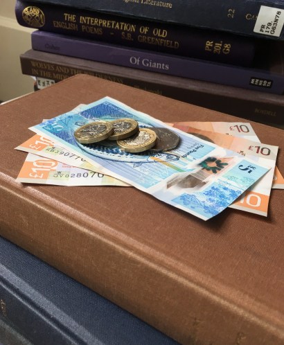 Money on top of books