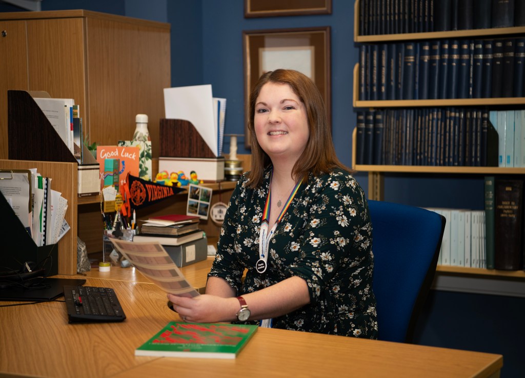 Photograph of Sarah Mackay at her desk.