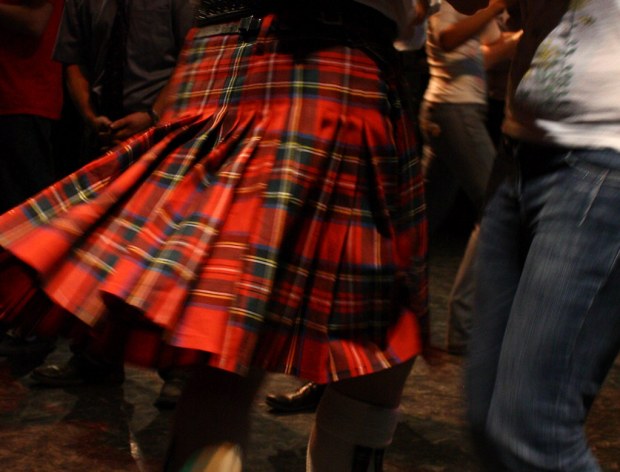 Red kilt and Ceilidh dancers at the Scots Music Group's ceilidh with the Bella McNab's Dance Band. 