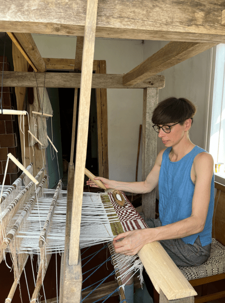 Cecilia at the loom. Credit Cecilia Charlton.