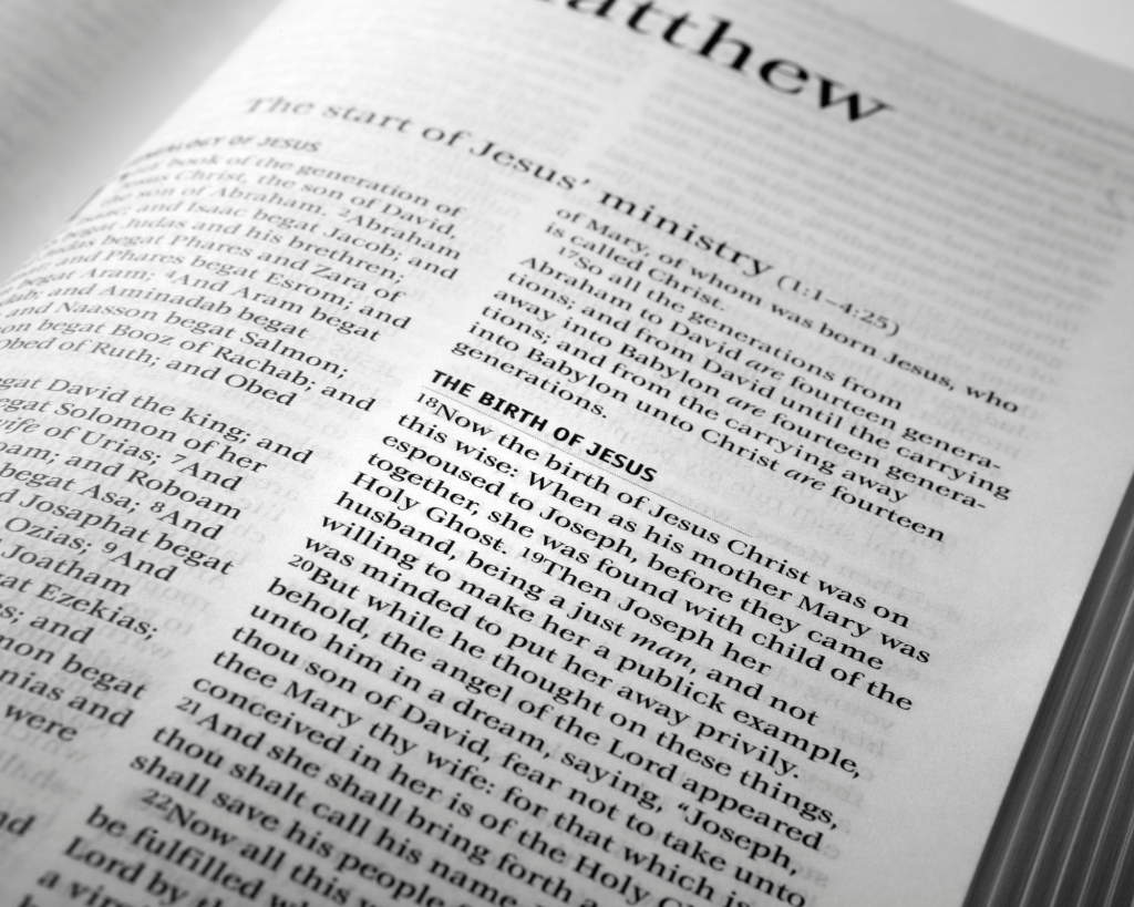 A biblical scripture of Matthew 1 vs 18 being shown