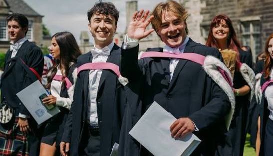 Two Male Graduates Celebrating